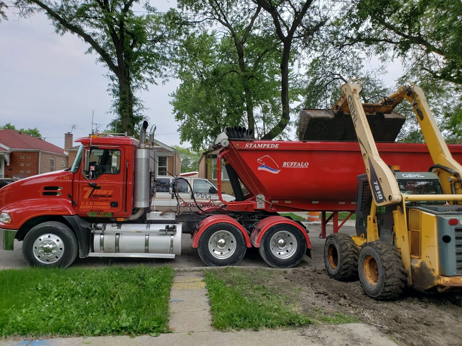Red Trim's Trucking trailer being loaded